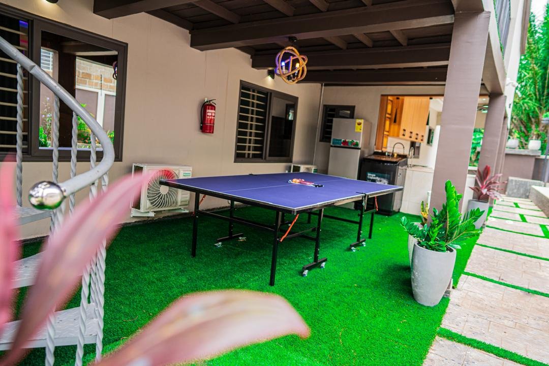 Guests enjoying table tennis at Geofranbert Hotel
