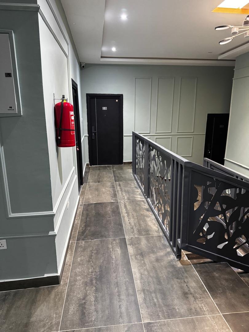 Upper-floor corridor at Geofranbert Hotel